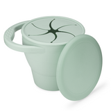 A gray silicone kids travel snack cup with a lid, designed with soft flaps for easy snack access and a handle for grip.