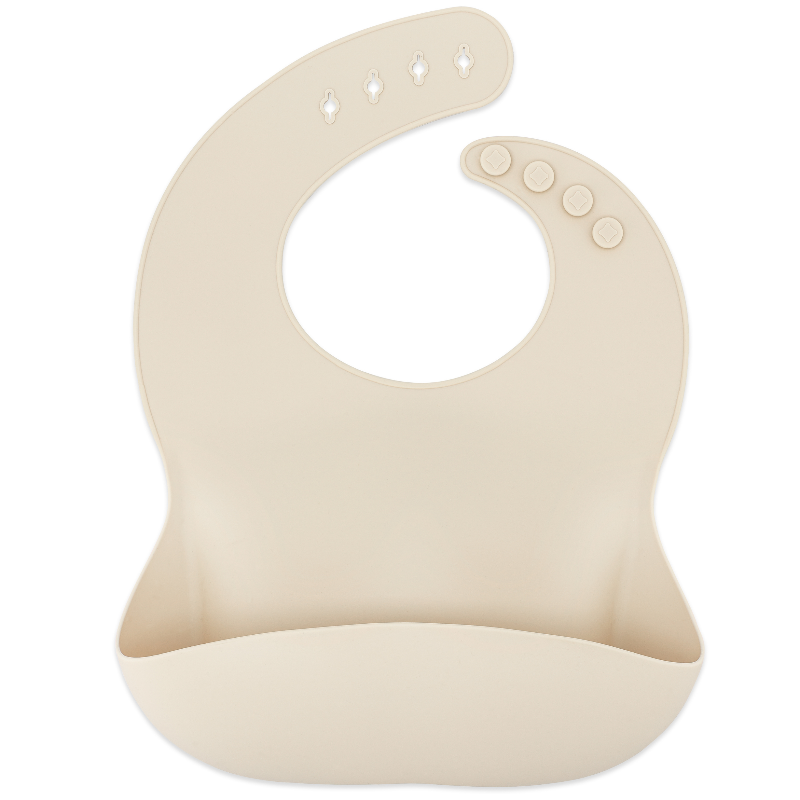 A silicone bib in a light pink color with adjustable neck straps and a pocket for food-catching.